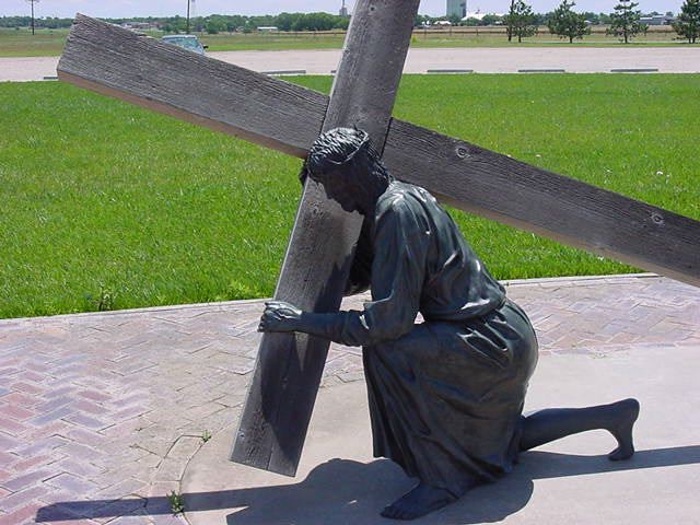 Jesus carrying cross - sculpture